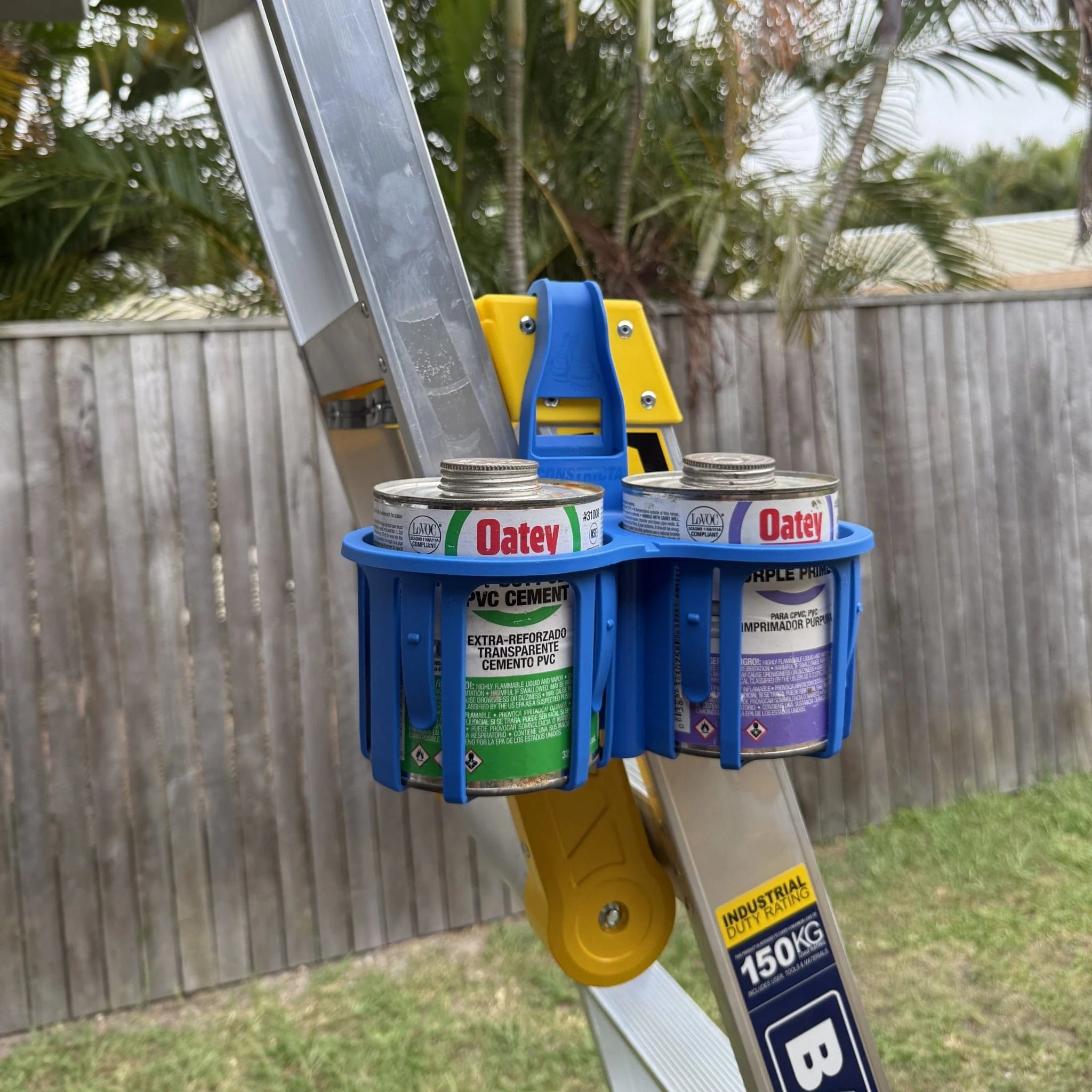 Rebend Constricta Multi Pot Grip hanging on ladder holding Oatey PVC Cement and Primer