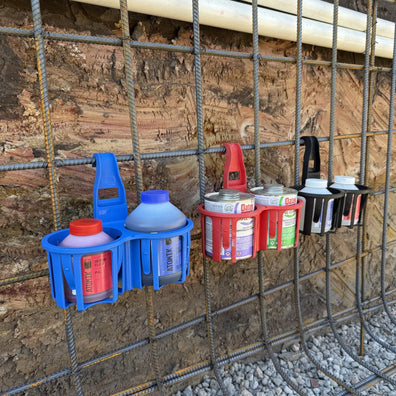 Rebends Constricta Glue Pots holding glue, primer and PVC cement attached to a concrete wall.