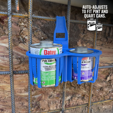 Blue can holder with paint cans on a wooden background